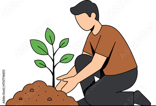 A man is planting a tree in the ground, carefully placing the roots in the soil to help it grow