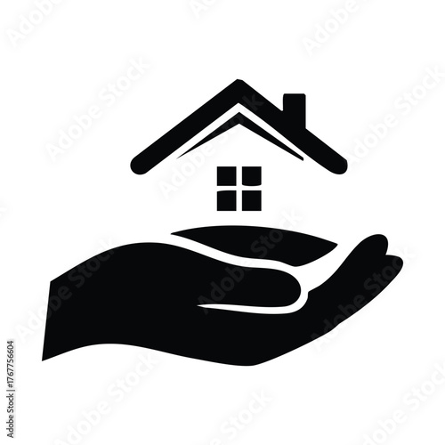 Black silhouette of a house resting on an open hand on a white background Keywords: hand, house, home, real estate, protection, care, safety, security, shelter, support, housing, property