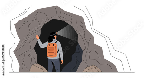 Adventurous Explorer Investigating a Dark Cave Illuminated by Headlamp Light Source