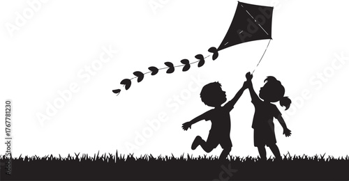 Two children silhouettes playing with a kite in a grassy field girl