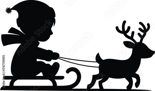 Silhouette of a child on a sled pulled by a reindeer festive winter scene