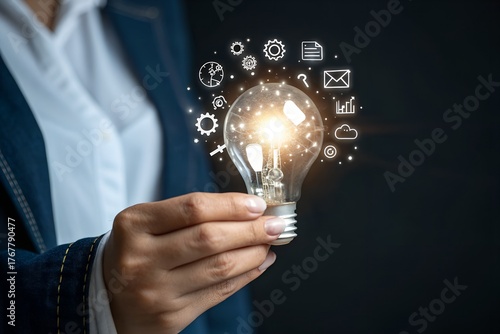 Businessman holding glowing lightbulb and question mark with copy space for creative thinking idea and problem solving concept.