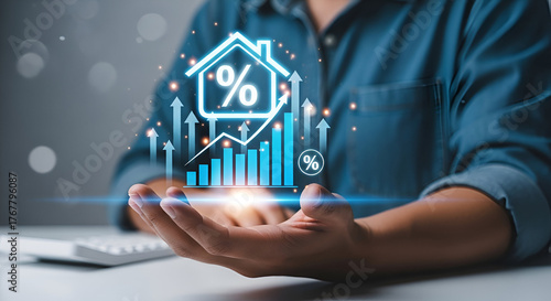 Person holding holographic house with mortgage interest graph