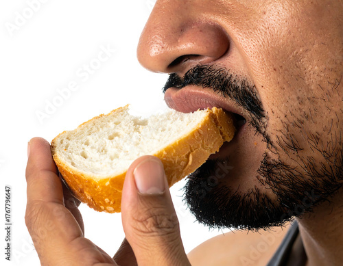 Close-up of a person eating a slice of white bread, focusing on the mouth, nose, and hand holding the bread