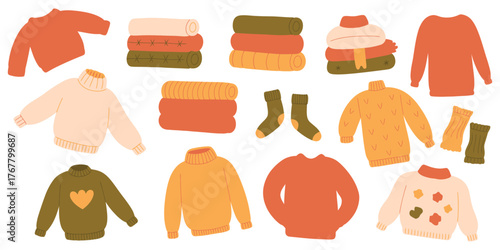 sweaters and jumpers set Stack of warm knitted cardigans and pile of cozy winter and fall apparel isolated on white background