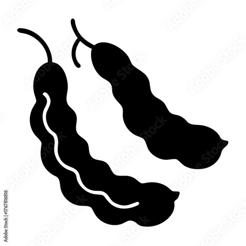 A black silhouette of two tamarind pods with wavy texture and stems, isolated on a
