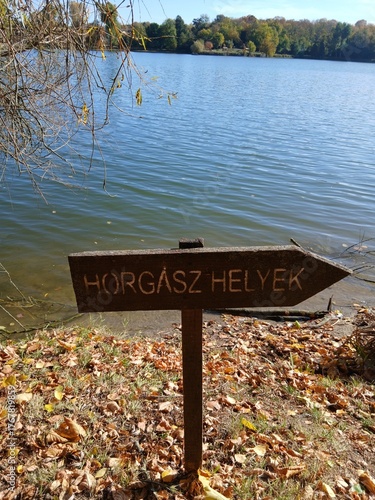 wooden sign on the lake