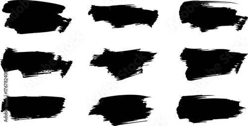 Collection of nine abstract black brush stroke textures on a white background for design elements