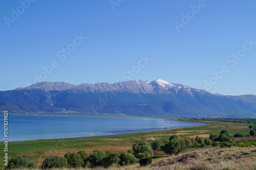 Peaceful lakeside scenery with calm waters along the shore of Lake Eğirdir.