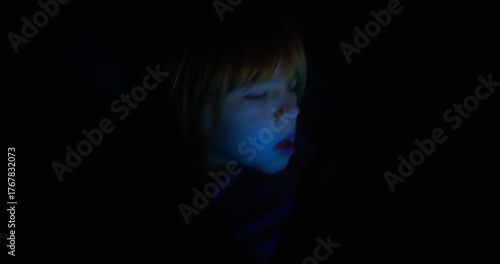 Frustrated Child Studying at Home with a Tablet During Evening Lessons