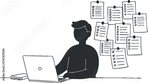 A person working on a laptop surrounded by notes and reminders in a modern workspace.