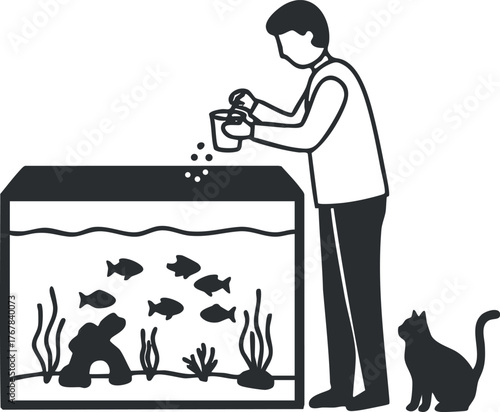 Person feeding fish in an aquarium with a cat observing the scene nearby