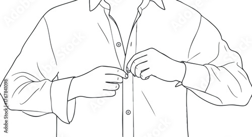 A man buttoning up a shirt showcasing a casual yet stylish outfit and gesture.