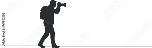 A silhouette of a man holding a camera, symbolizing adventure and outdoor photography.