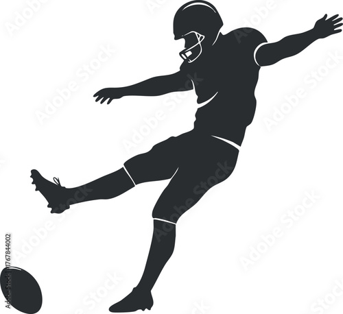 A dynamic silhouette of a football player executing a powerful kick during a game.