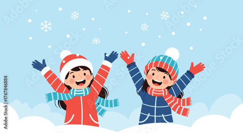 Two happy young girls joyfully playing in falling snow during a cheerful winter day, dressed warmly for the cold weather.