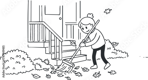 A person raking leaves in a garden during autumn season by a house.