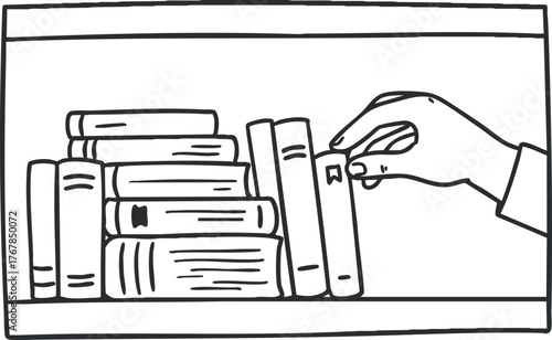 Hand placing a book on a shelf among various other books in a cozy setting.