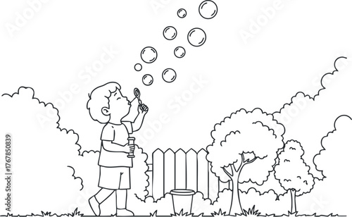A child happily blowing bubbles in a garden surrounded by trees and a fence.