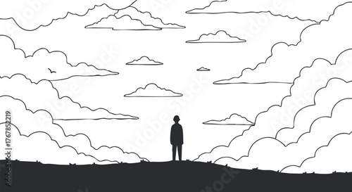 A silhouette of a person standing peacefully against a backdrop of clouds and a vast sky.