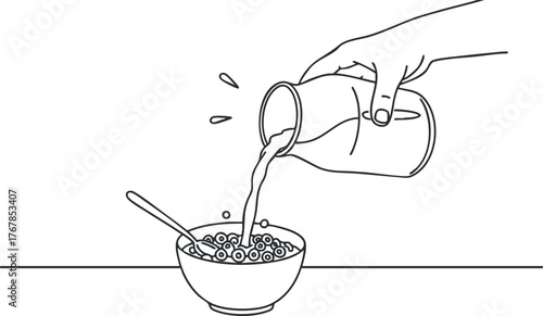 A hand pouring milk into a bowl of cereal with a spoon ready for breakfast.