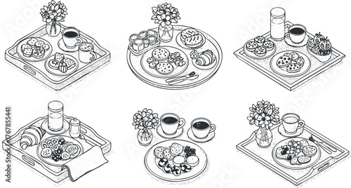 A delightful assortment of breakfast trays featuring cookies pastries and beverages with flowers.