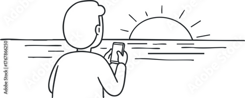 A man enjoying a sunset view by the ocean while using his smartphone.