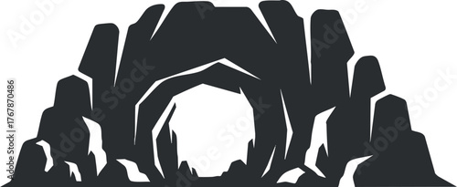 A silhouette of a cave entrance surrounded by rugged rock formations creating a mysterious ambiance.