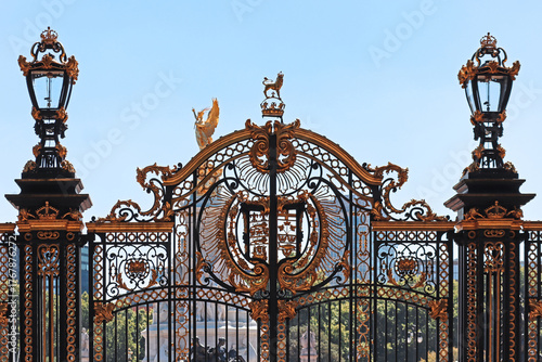 London, United Kingdom - August 11, 2022: Decorative iron gate detail at Buckingham Palace with gold ornaments
