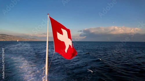 Real Time of 4K Swiss National Flag Waving Over Lake Geneva, Switzerland.