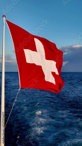 Real Time of 4K Swiss National Flag Waving Over Lake Geneva, Switzerland.