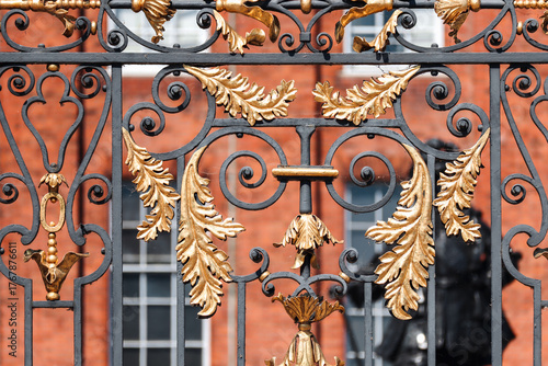 Wall Mural London, United Kingdom - August 13, 2022: Ornate black and gold wrought-iron gat