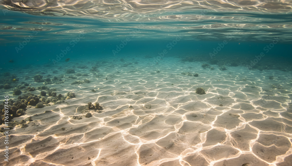 Naklejka premium Underwater Tranquility: Sandy Seabed with Turquoise Water & Sunbeams - Oceanic Background for Coastal Lifestyle & Wellness Concepts