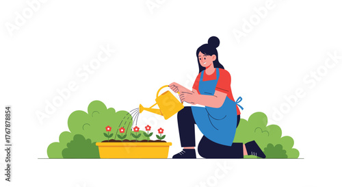 Woman kneeling and watering flowers in a yellow planter with green bushes in the background.
