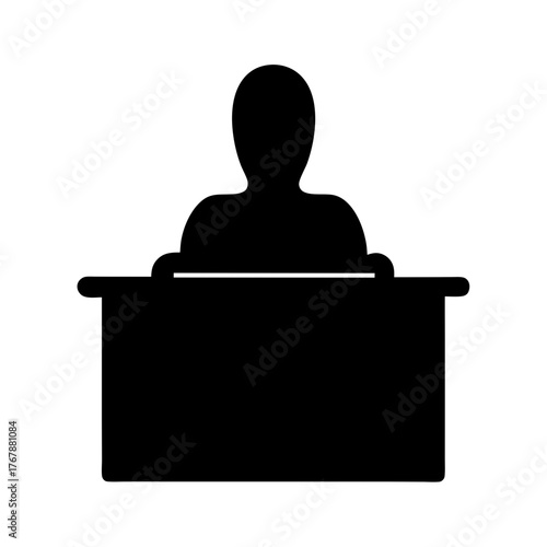 Silhouette of a person sitting behind a desk in black and white