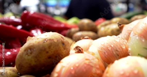 Freshly harvested onions glistening with water in a vibrant market scene