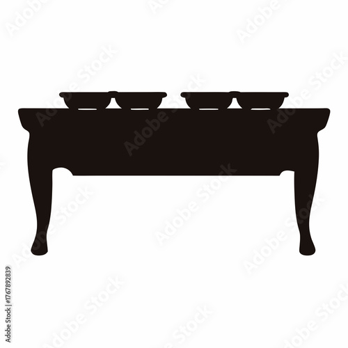 Silhouette of a buffet table with warming trays in a single image