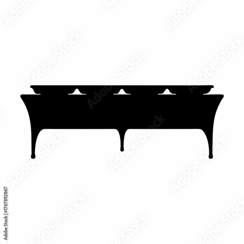 Silhouette of an elegant buffet table with tiered serving dishes arrangement