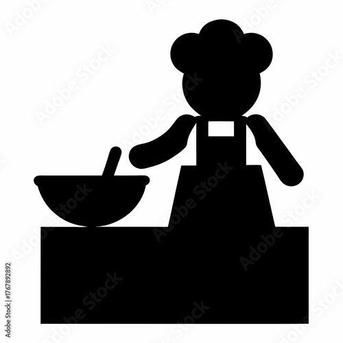 Silhouette of a chef preparing food in a bowl on a table