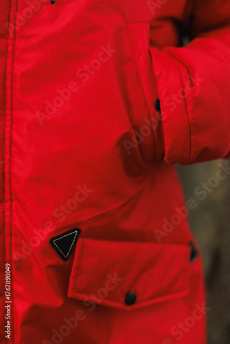 closeup of bright winter parka pocket, texture and color highlight playful outdoor fashion statement