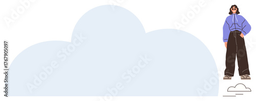 Woman in a casual hoodie and wide pants standing confidently next to a large soft cloud. Ideal for creativity, imagination, modern lifestyle, freedom, individuality, dreamthumbs up concepts