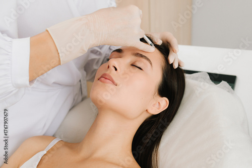 Konstfotografi Forehead botulinum toxin injection smooths fine lines and relaxes muscles