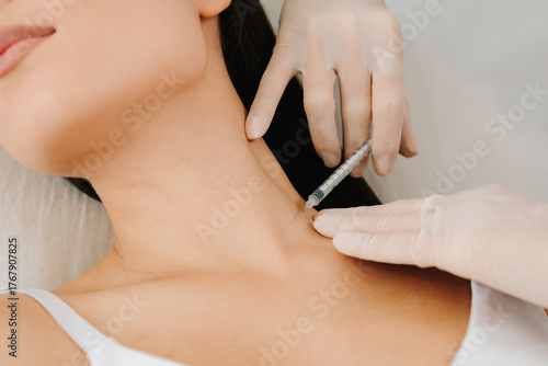 Tableau sur toile Botulinum toxin injection into the platysma relaxes neck bands