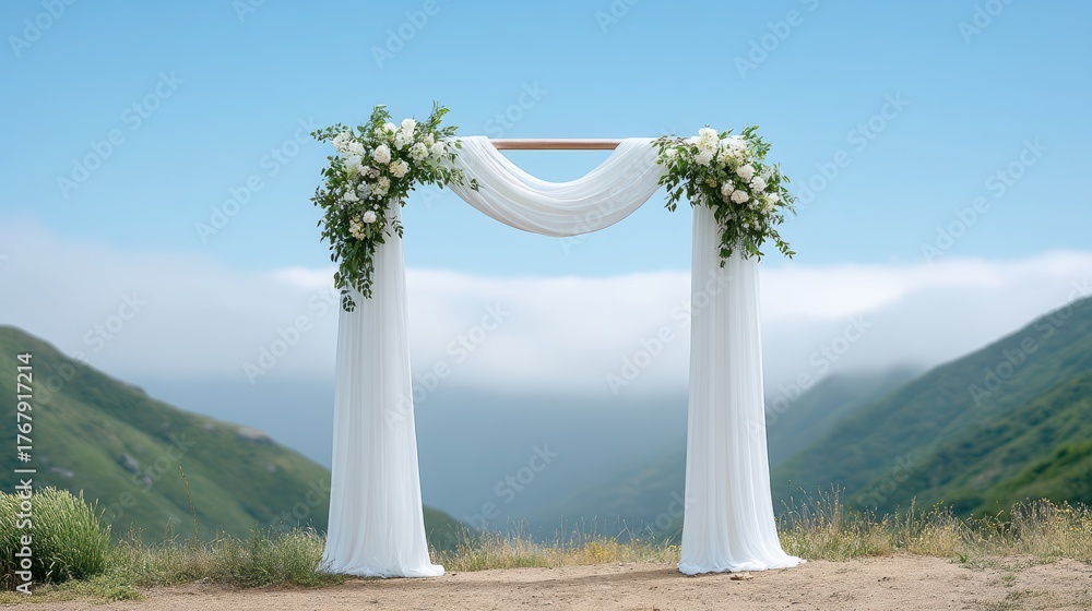 Fototapeta premium Beautiful floral arch set against a serene landscape with rolling hills and misty sky.