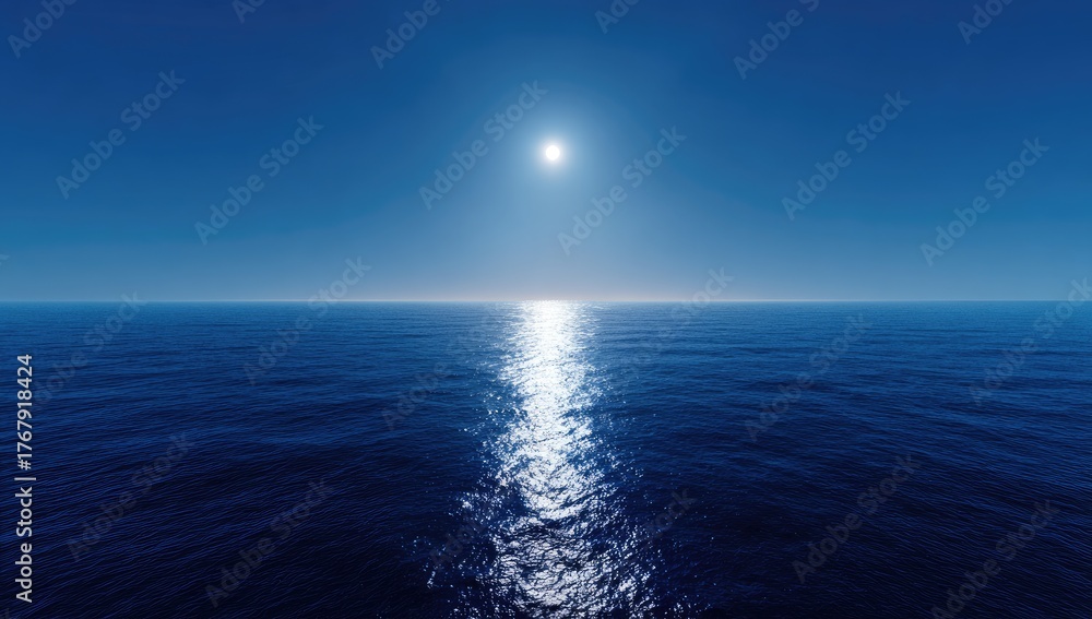 Obraz premium Bright sun shines on the calm blue ocean under a clear sky.
