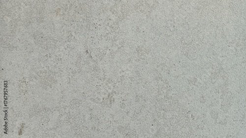 Sandy rough white or light gray surface background.