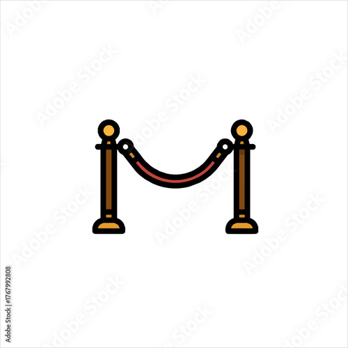 Red velvet rope barrier stands elegantly, marking exclusivity and VIP access at a premiere event, creating a sense of anticipation and glamour.