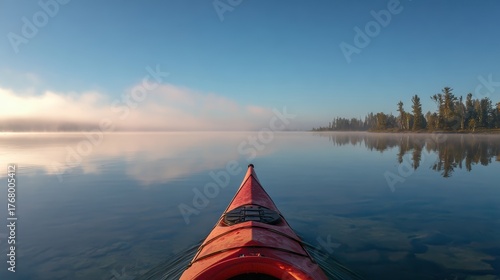 Calm Morning Kayak Ride on Serene Lake with Misty Background