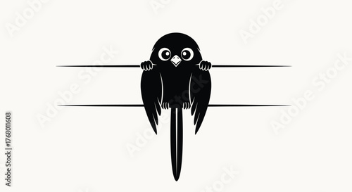 Adorable black bird clinging to a line