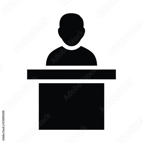 Silhouette of a person standing behind a podium giving a speech